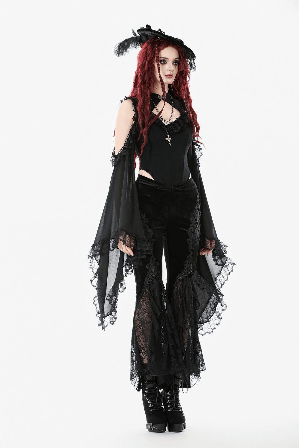 Gothic Black Velvet Pants with Lace Ruffle Panels worn with a dramatic black outfit and accessories.