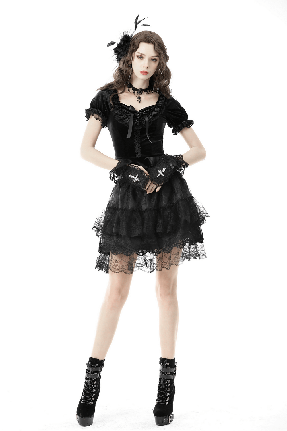 Gothic black velvet puff sleeve top with lace-up detail, paired with a layered lace skirt for a romantic edgy look.