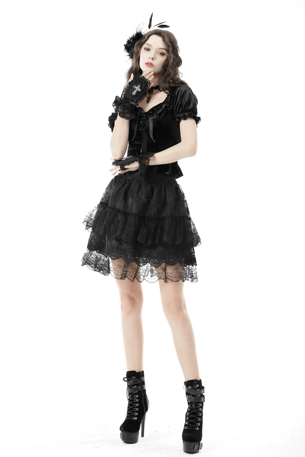 Gothic black velvet top with puff sleeves, lace-up detail, and layered lace skirt for a dramatic, elegant look.