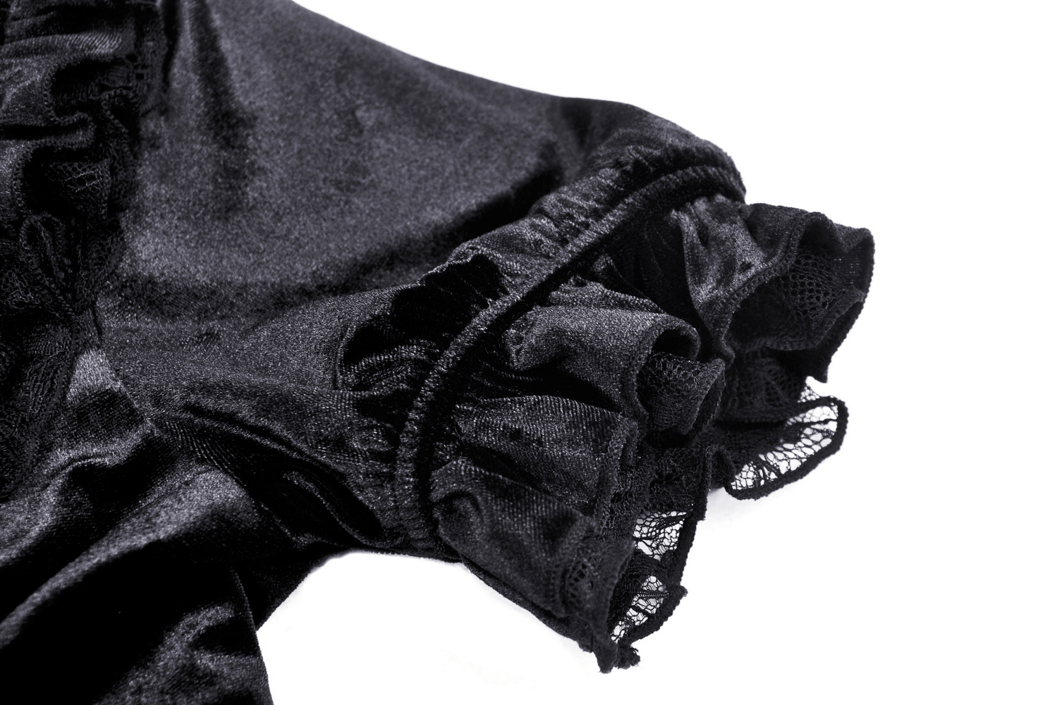 Close-up of gothic black velvet puff sleeve with lace trim detail, showcasing romantic and edgy style.