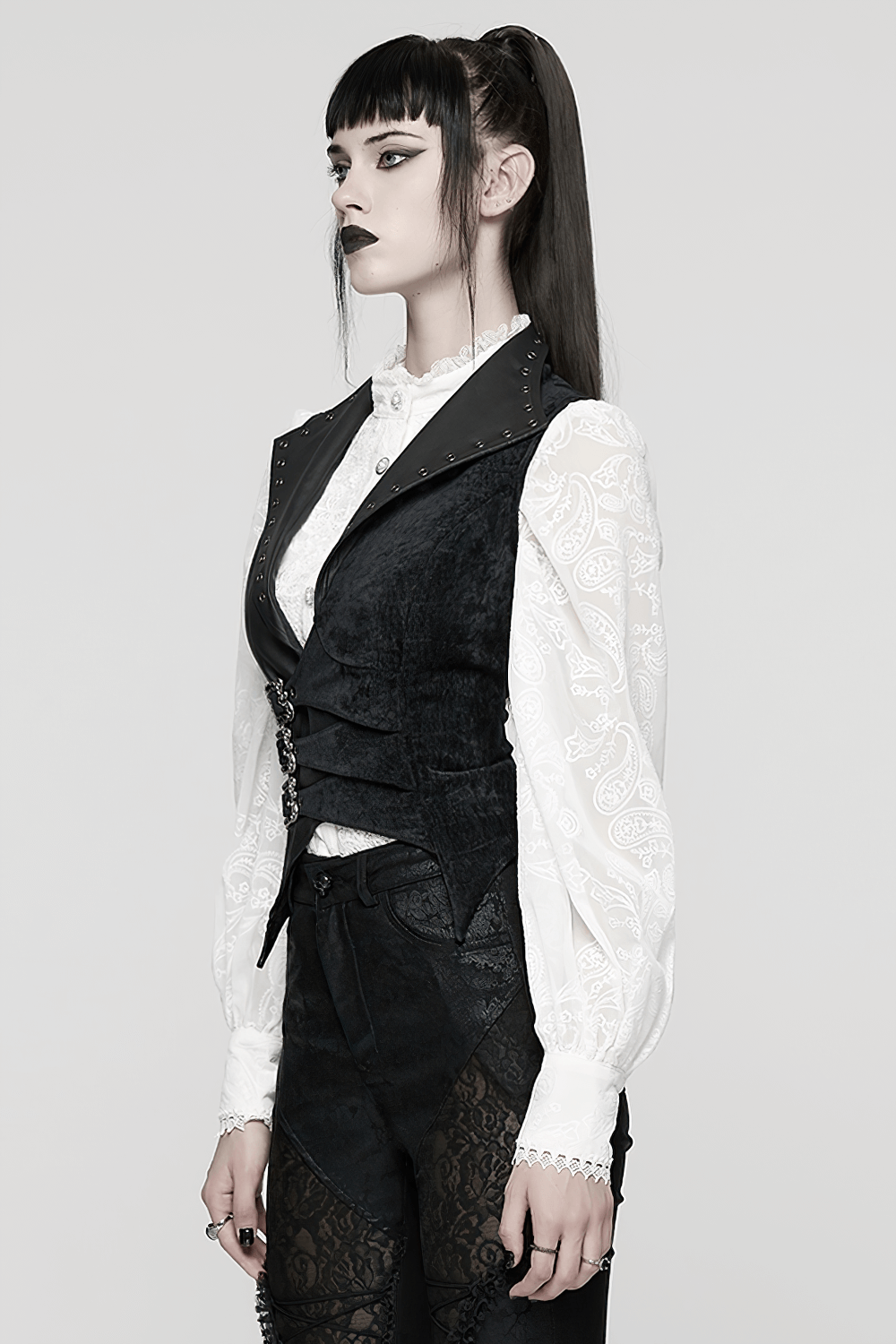 Gothic Black Velvet Punk Vest with Buckle Straps worn over a white blouse, showcasing edgy Gothic style and unique detailing.