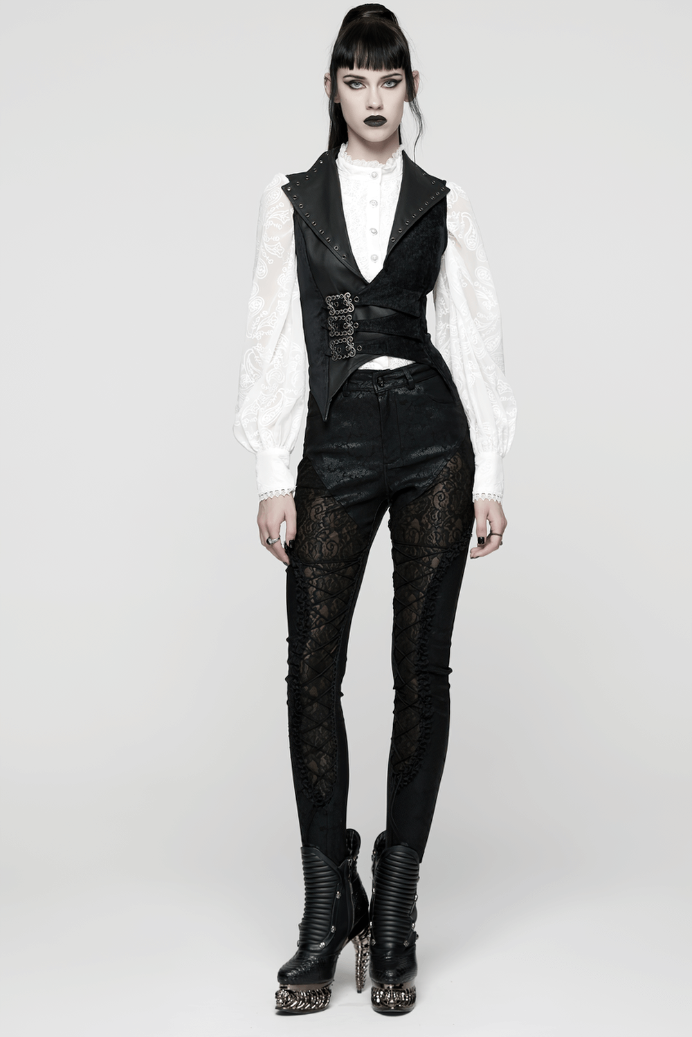 Gothic Black Velvet Punk Vest with Buckle Straps worn over a white shirt, paired with lace pants and edgy footwear.