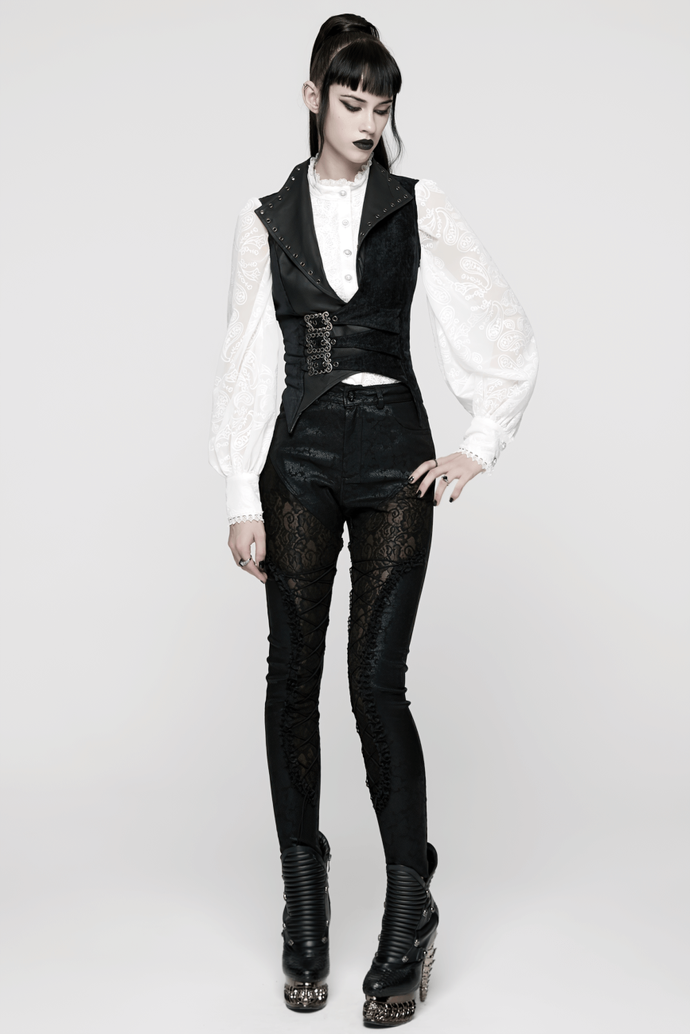 Gothic Black Velvet Punk Vest with Buckle Straps worn with a stylish layered outfit and edgy accessories.