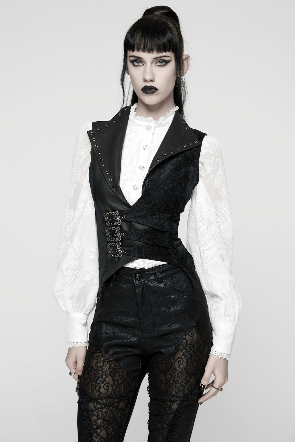 Gothic Black Velvet Punk Vest with Buckle Straps worn with a white blouse, showcasing an edgy punk style and unique design elements.