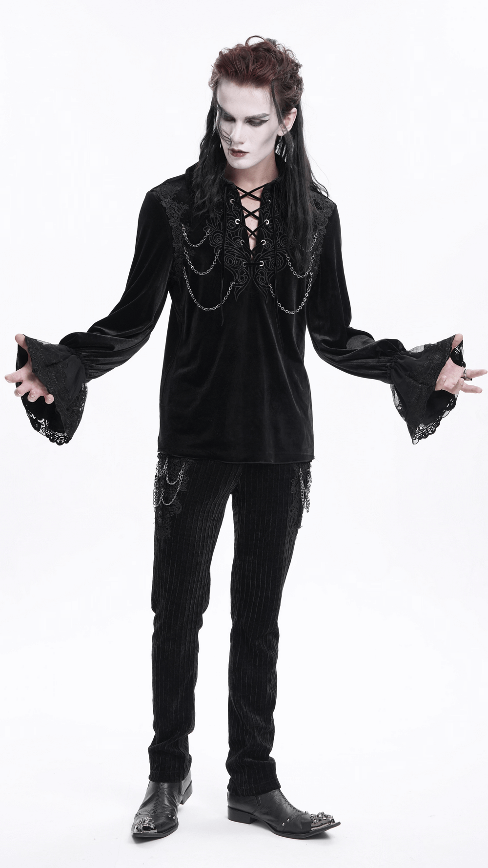 Gothic black velvet shirt with lace-up front and chain details, paired with black pants, perfect for Victorian-inspired fashion.