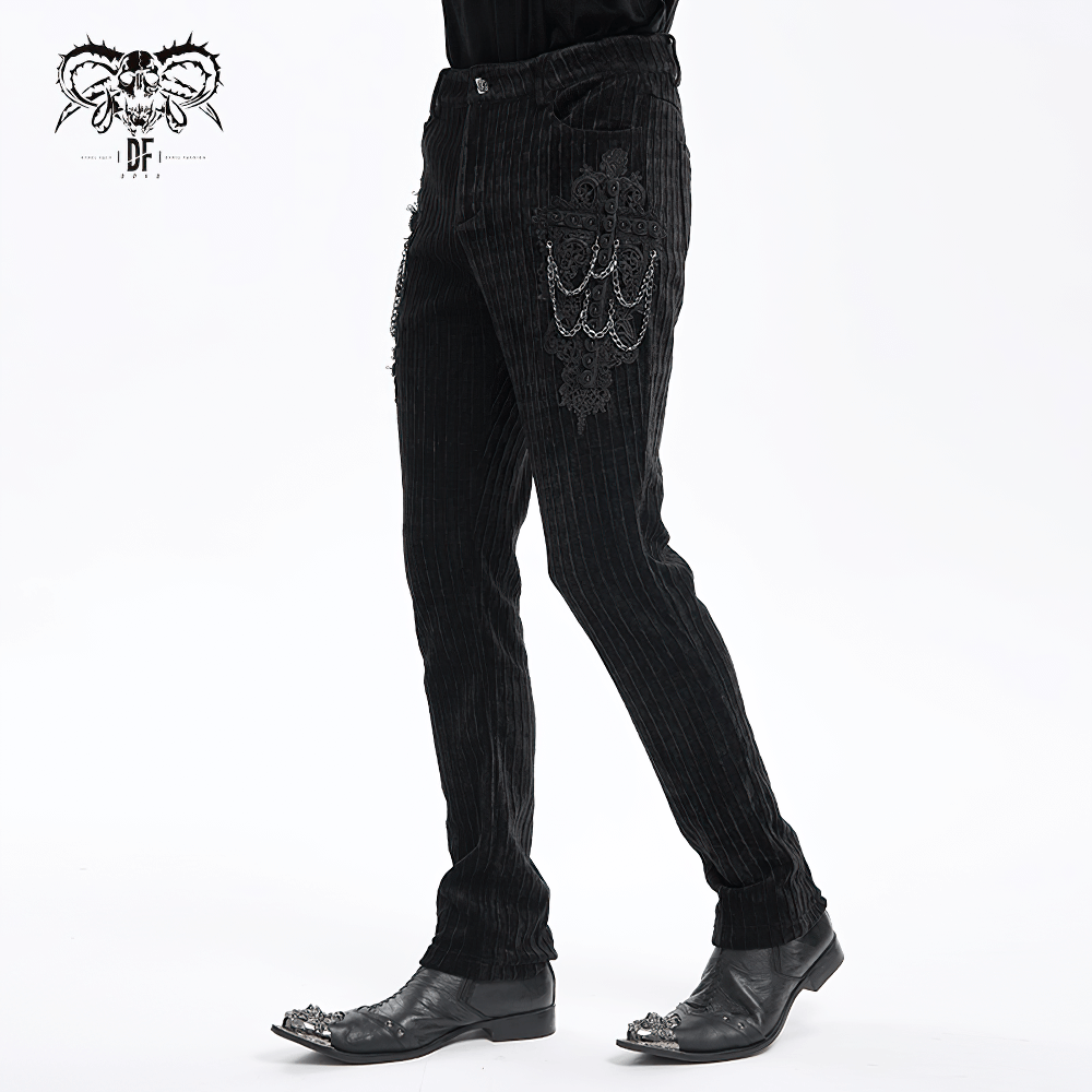 Gothic black velvet slim fit pants with embroidered details and chains, perfect for bold fashion statements.