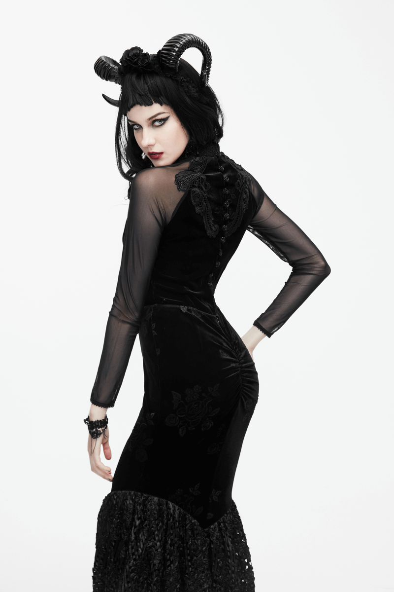 Gothic black velvet top with mesh sleeves and ornate embroidery, modeled by a woman with striking makeup and horns.