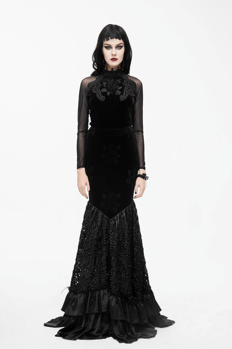 Gothic black velvet top featuring long mesh sleeves and intricate embroidery, perfect for a stylish, dramatic look.