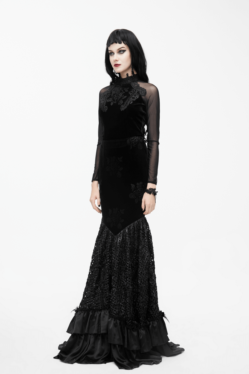 Gothic black velvet top with embroidery and long mesh sleeves, featuring rose buttons and a stylish flared silhouette.