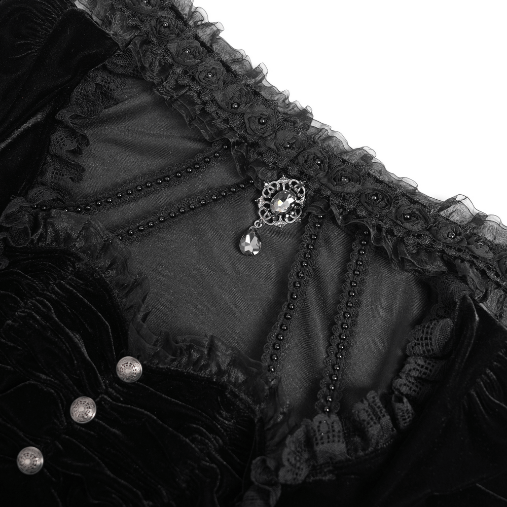 Close-up of Gothic black velvet top with lace detailing and ornate buttons, showcasing dark elegance and Victorian flair.