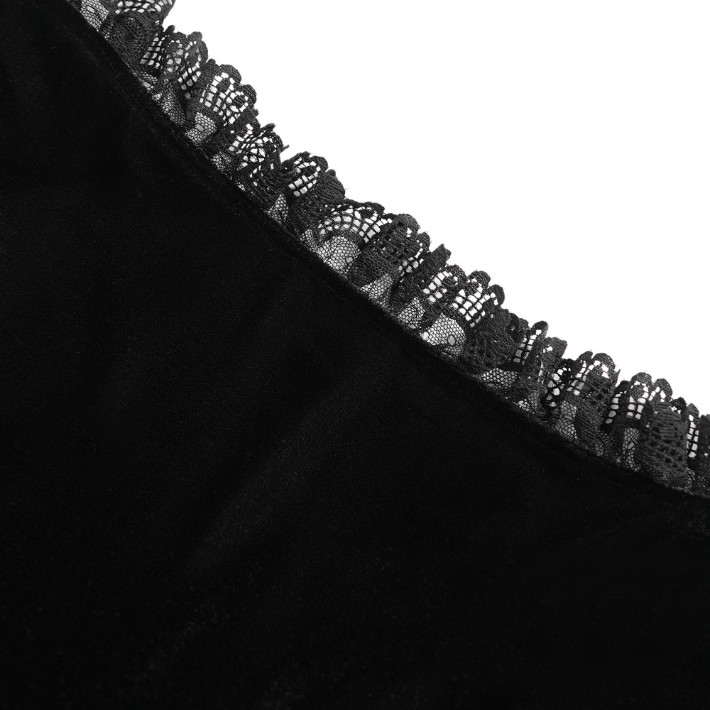 Close-up of gothic black velvet top showcasing intricate lace trim and ruffled neckline for dark elegance.