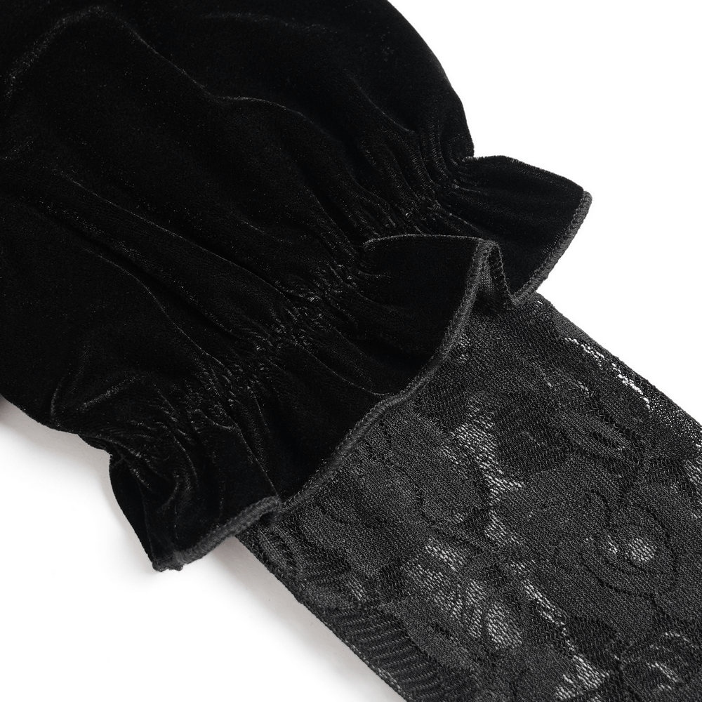 Close-up of gothic black velvet top's lace bell sleeves and ruched velvet detail, showcasing intricate floral design.