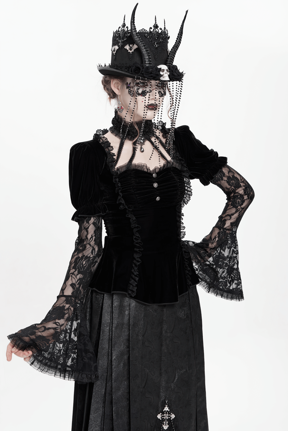 Gothic black velvet blouse with lace bell sleeves and ornate buttons, perfect for a Victorian-inspired look.