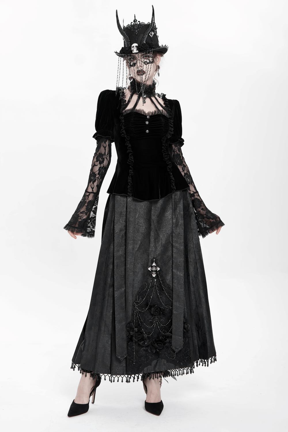 Gothic black velvet top with lace bell sleeves paired with a dramatic skirt, embodying dark elegance and Victorian style.