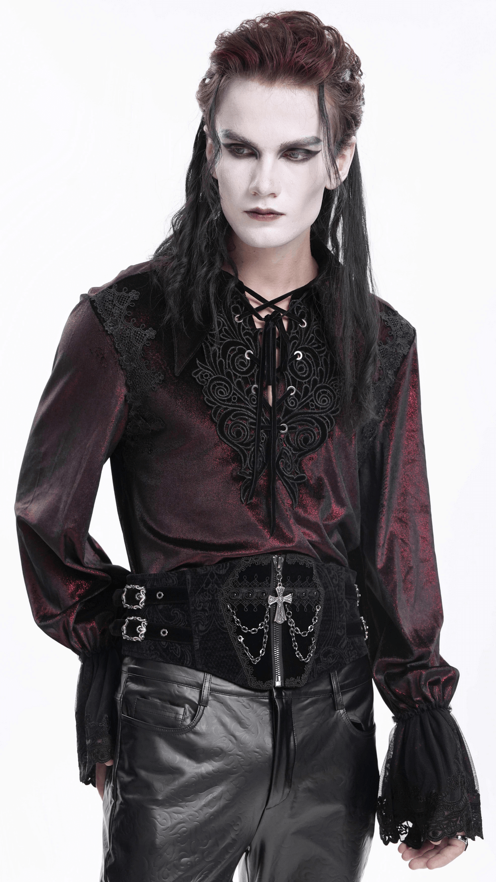 Model in gothic attire wearing a black waist cincher with chains, complementing dark Victorian-inspired fashion.