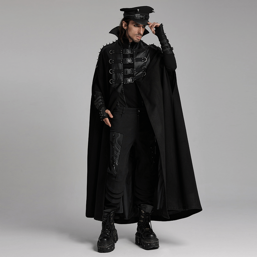 Gothic black woolen cape with bold buckle accents, styled for a punk look, worn by a model. Perfect for themed events.