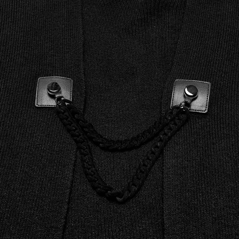 Close-up of gothic black shawl details showing chain accents and button clasps for a stylish look.