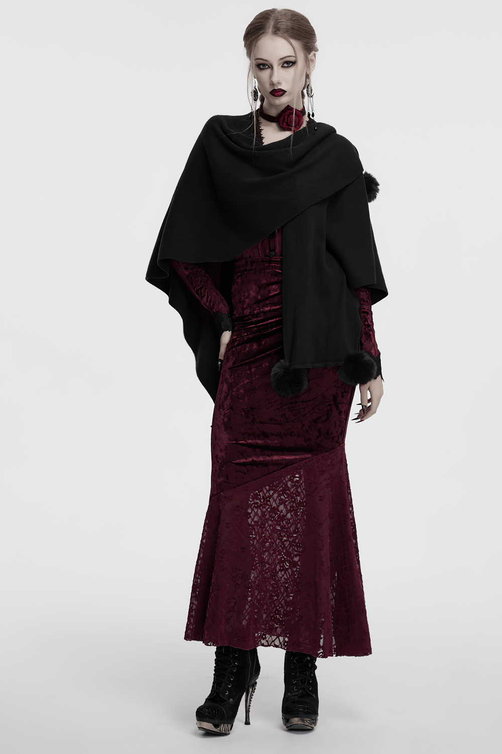 Gothic black woolen shawl with lunar eclipse print, layered over a burgundy velvet dress, exuding witchy elegance.
