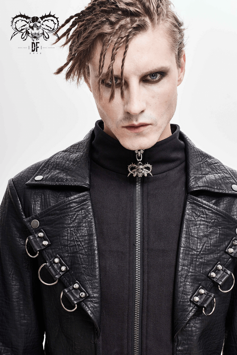Gothic black leather coat with studs and D-rings worn by model, showcasing a striking retro style.