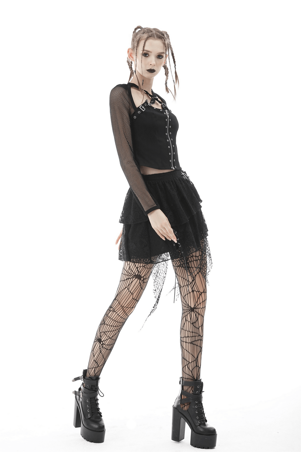 Gothic black mesh top with zipper and studs, paired with a layered skirt and fishnet tights for an edgy look.