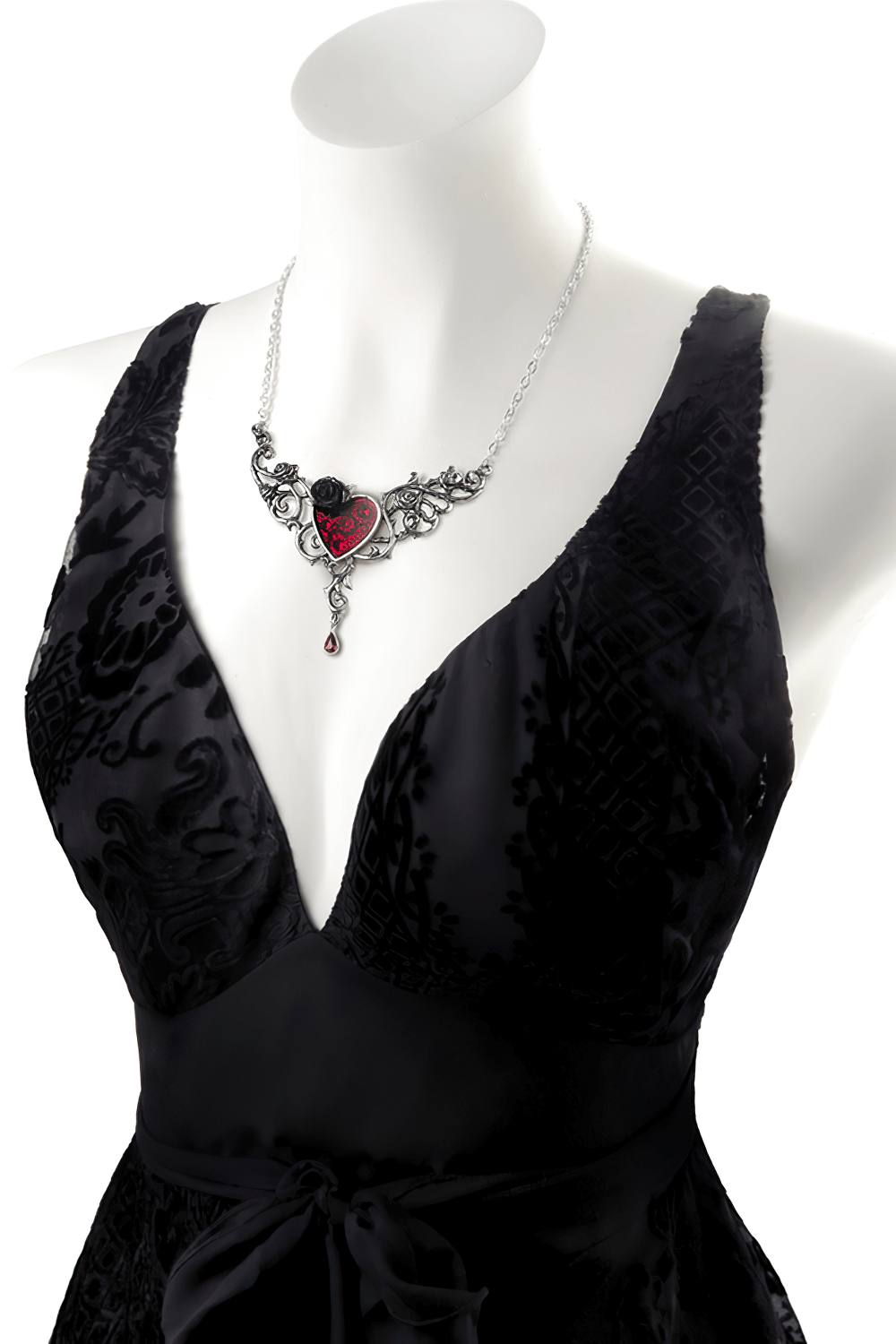 Gothic Blood Rose Heart Necklace with red enamel on a black dress, showcasing elegance and romance.