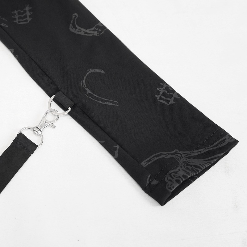 Close-up of gothic bone printed detail on stylish black zipper cape, showcasing unique design and metal clasp.