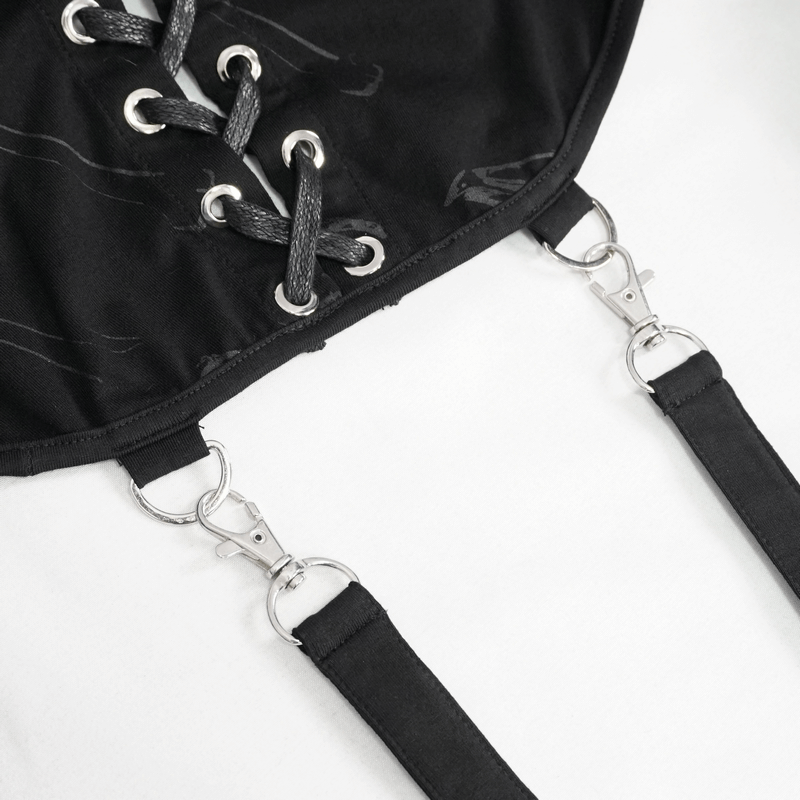 Close-up of gothic black cape with lacing and clips, showcasing stylish design details.