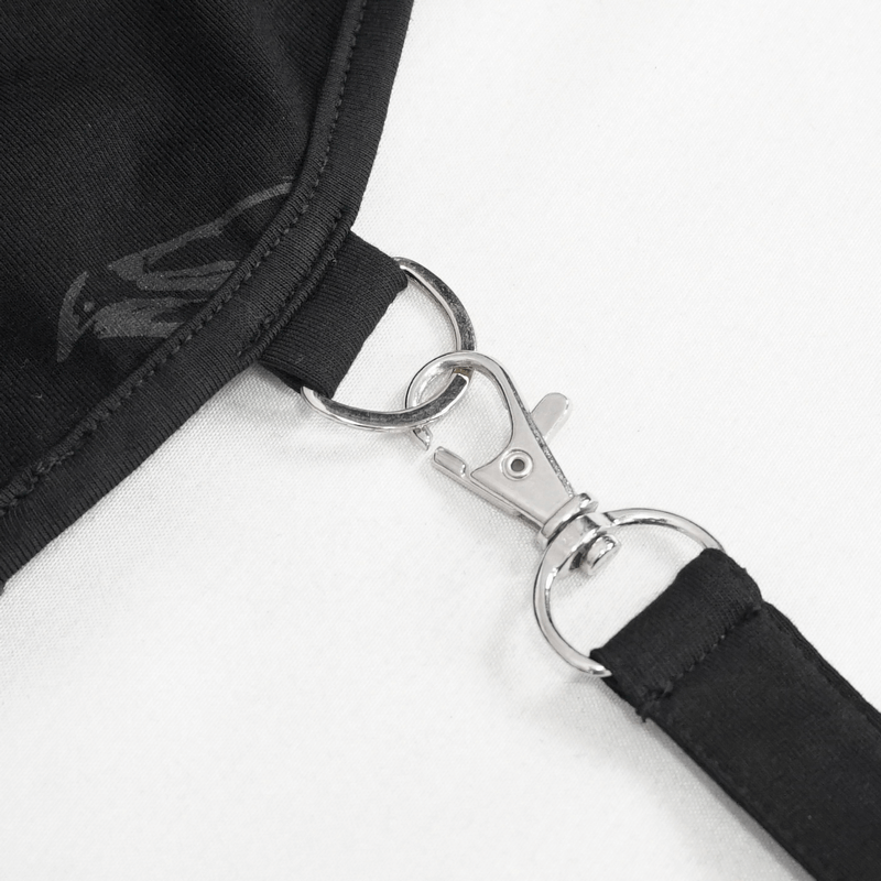 Close-up of the silver zipper clasp detail on a gothic women's black cape, featuring stylish lacing design.