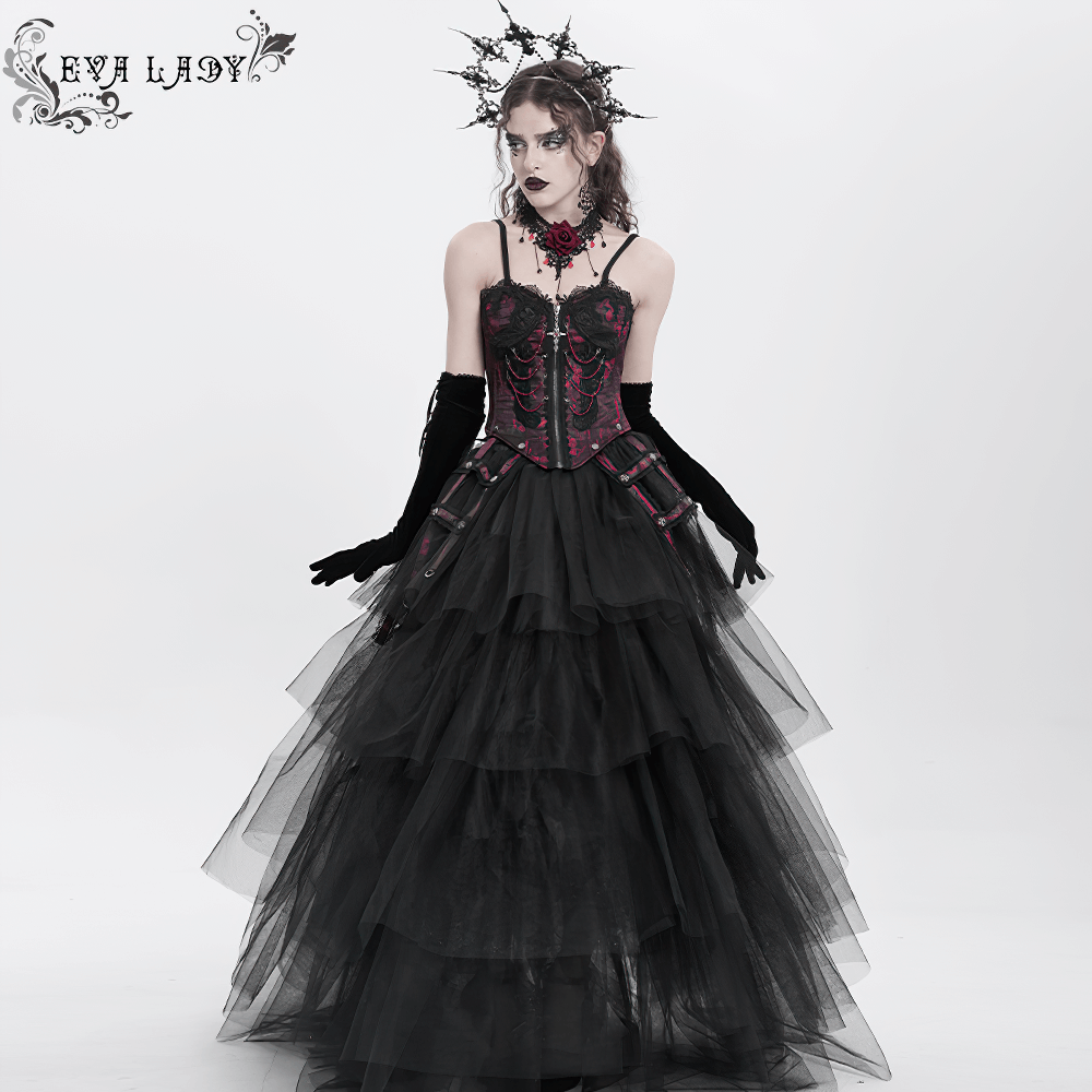 Gothic brocade corset with chains and garter straps, layered tulle skirt, and dramatic accessory for a dark romantic look.