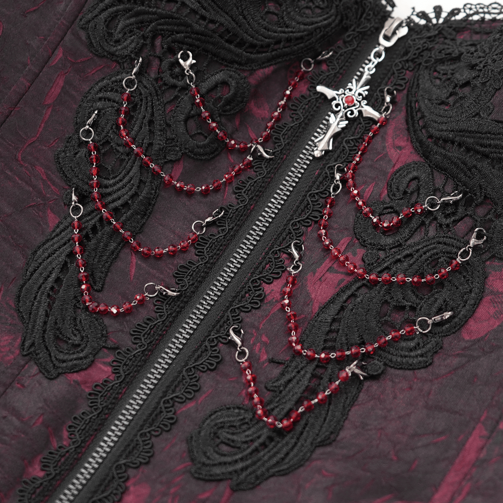 Close-up of a gothic brocade corset featuring intricate black lace and wine red chains for a punk-inspired look.