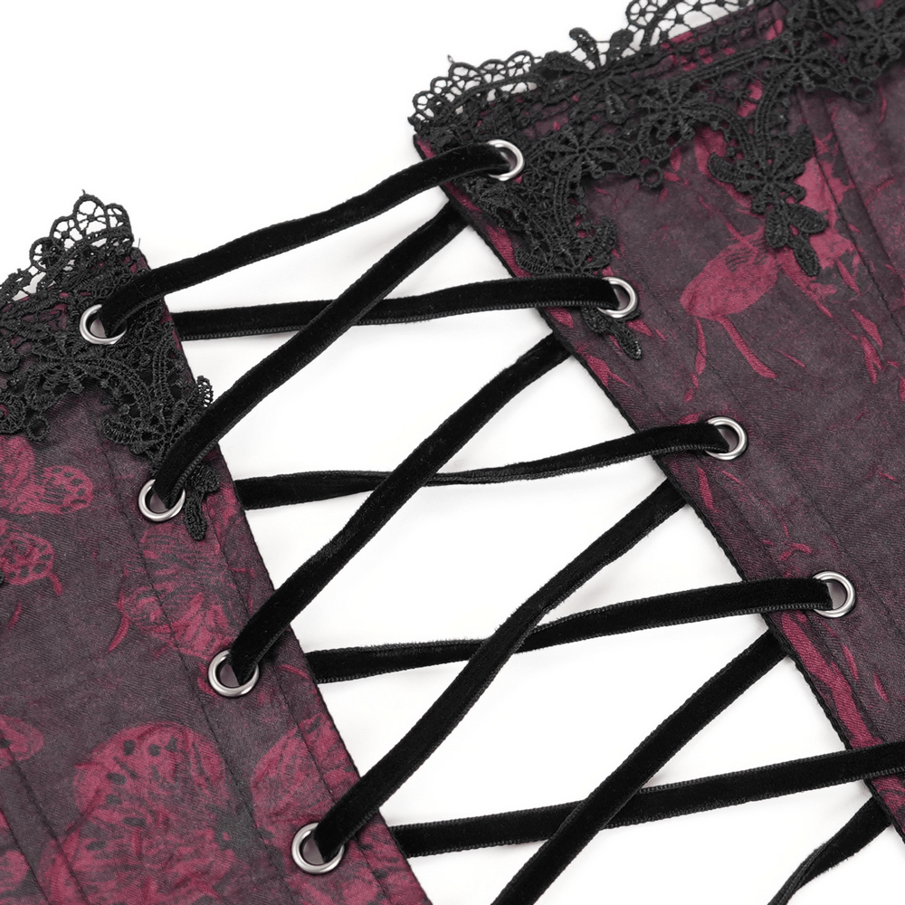 Close-up of gothic brocade corset with intricate lace trim and adjustable laces, showcasing a punk-inspired design.