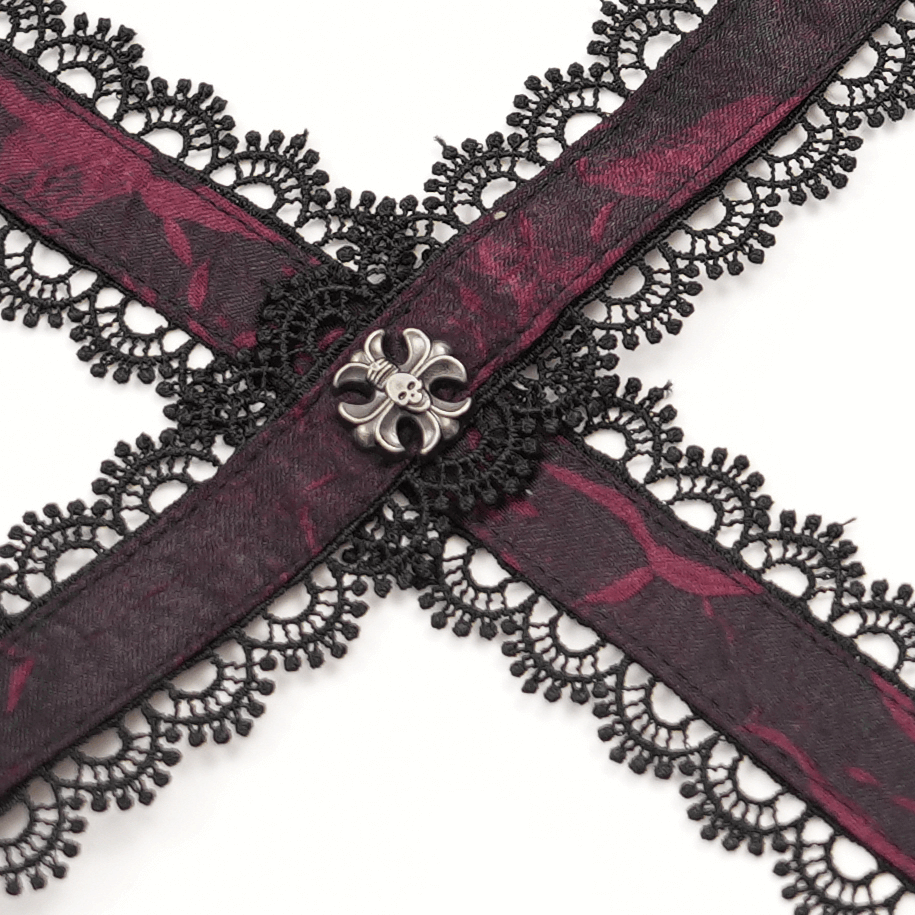 Close-up of wine red lace and brocade detailing with gothic floral button, perfect for a dramatic corset look.