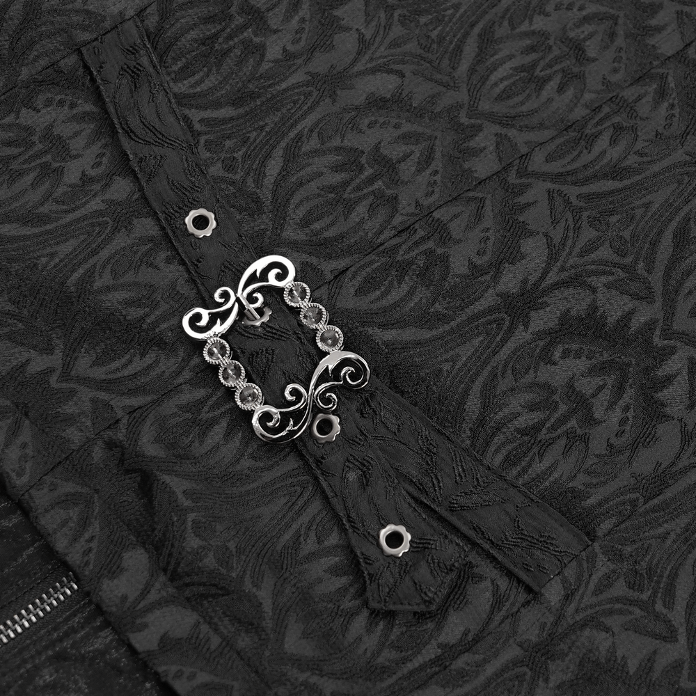 Close-up of the ornate buckle detail on a gothic brocade waistcoat, showcasing intricate black fabric and elegant design.
