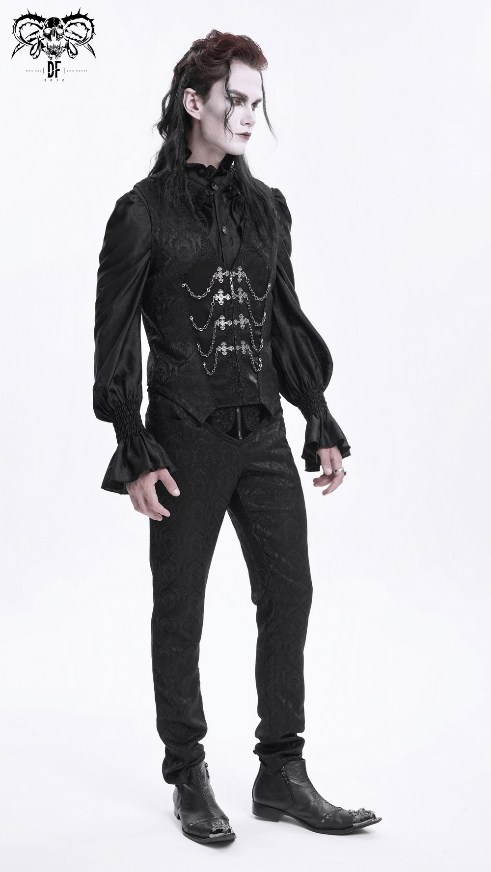 Gothic model wearing a brocade waistcoat with chains, showcasing dark elegance and Victorian-inspired style.