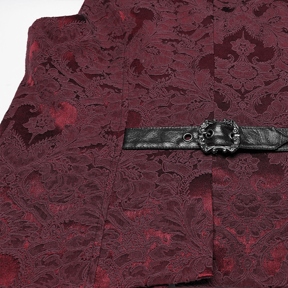 Gothic brocade waistcoat detail featuring leather buckle, rich jacquard fabric, and elegant bat hem design.