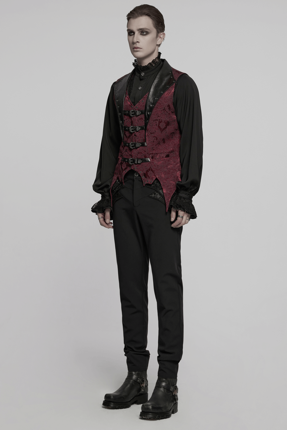 Gothic brocade waistcoat with leather buckles, bat hem, and eyelets, perfect for steampunk and gothic events.