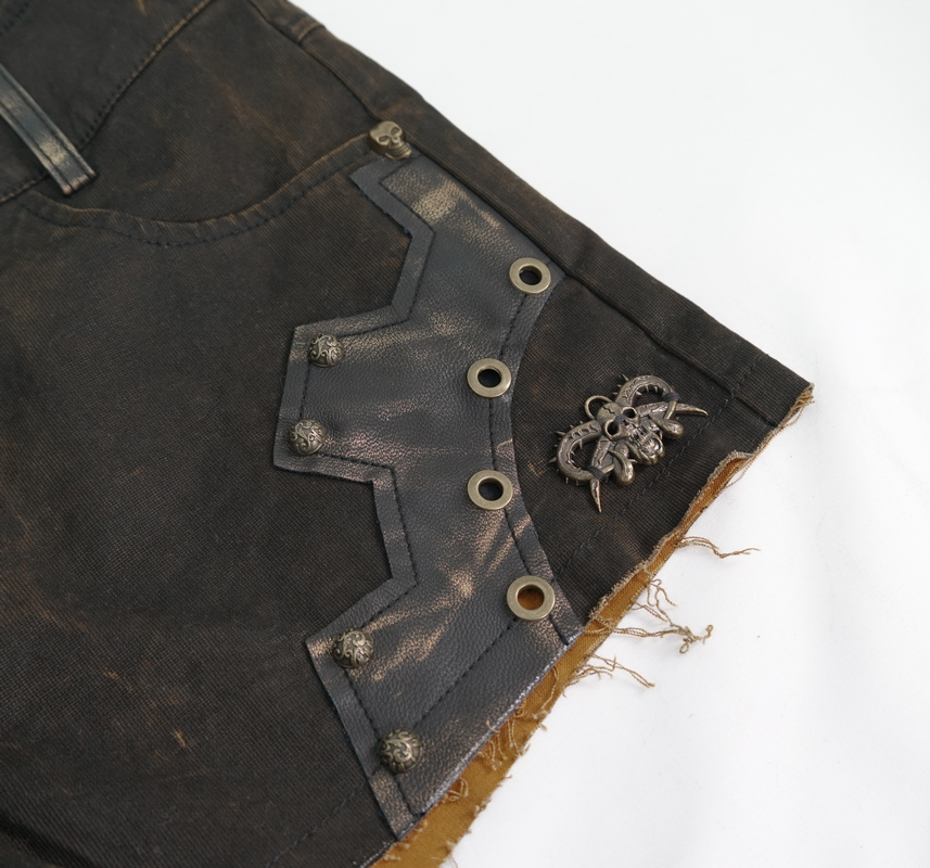 Close-up of Gothic brown shorts with leather inserts and bronze rivets, perfect for steampunk style.