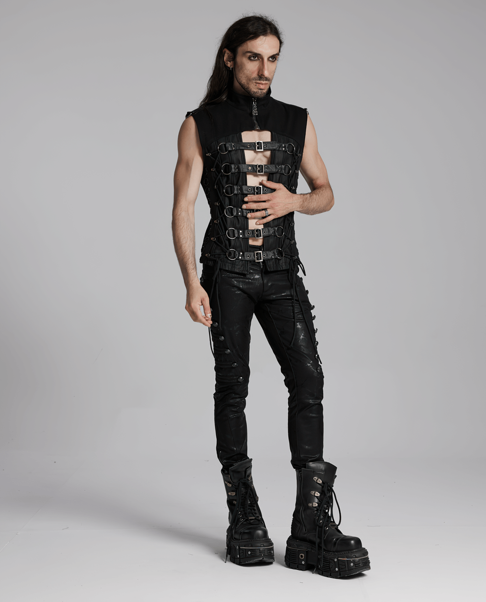 Edgy gothic vest with buckle straps and lace-up design, perfect for a punk aesthetic, worn by a model in black attire.