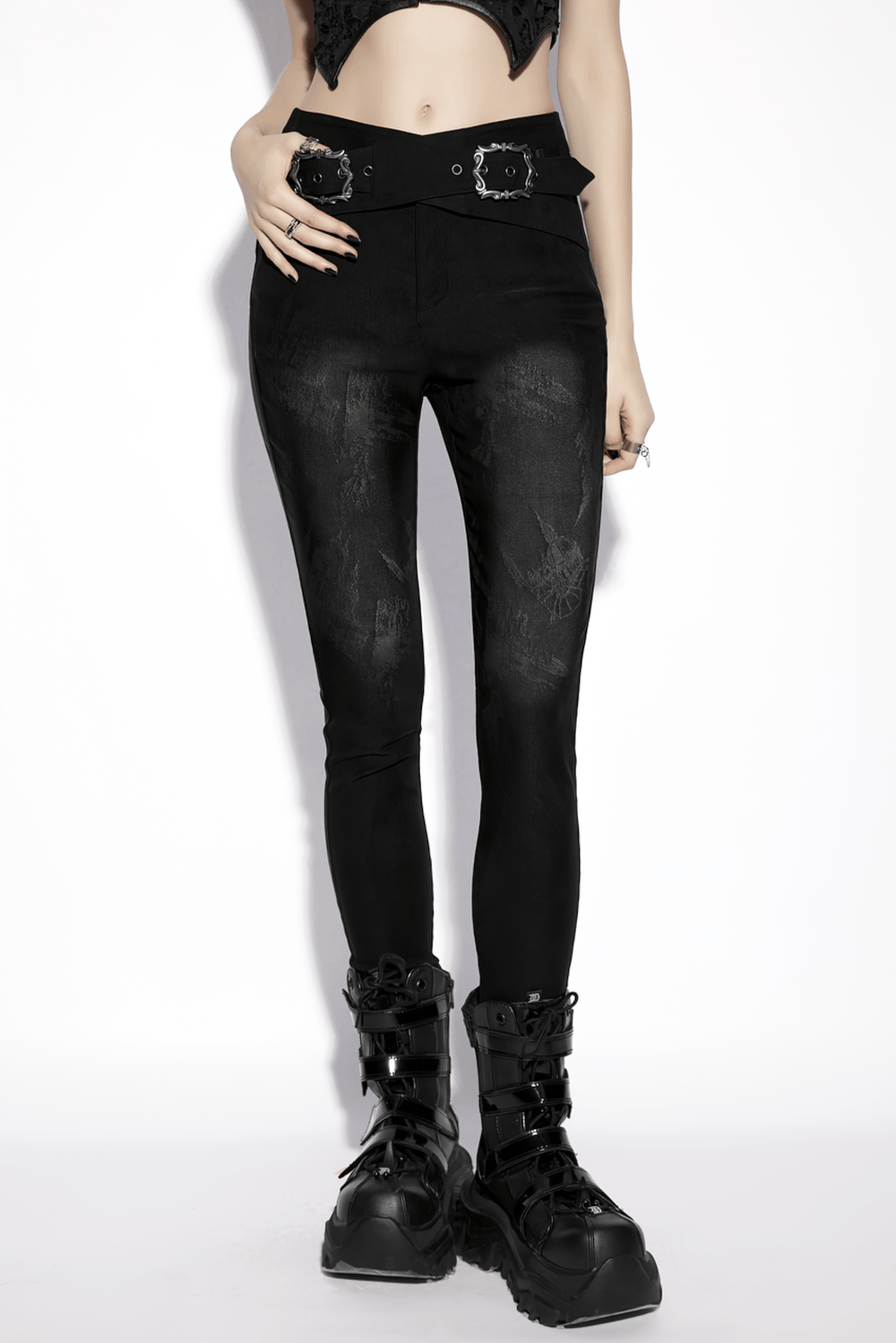 Gothic Buckle Waist Skinny Jacquard Denim Pants displayed with a dark pattern on lightweight fabric, paired with chunky boots.