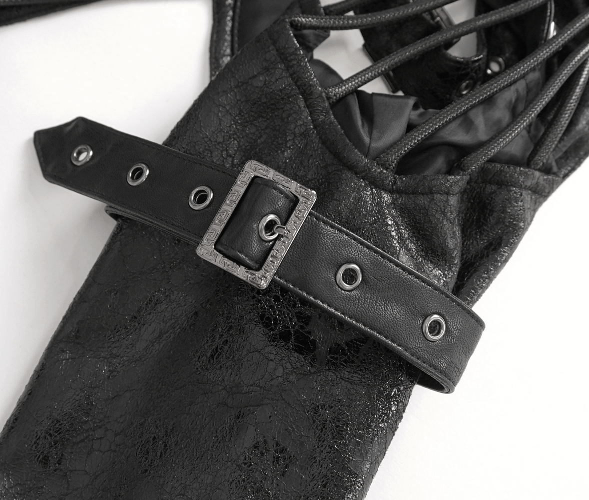 Gothic buckled one-shoulder accessory detail showcasing sleek black harness and adjustable strap for urban fashion.