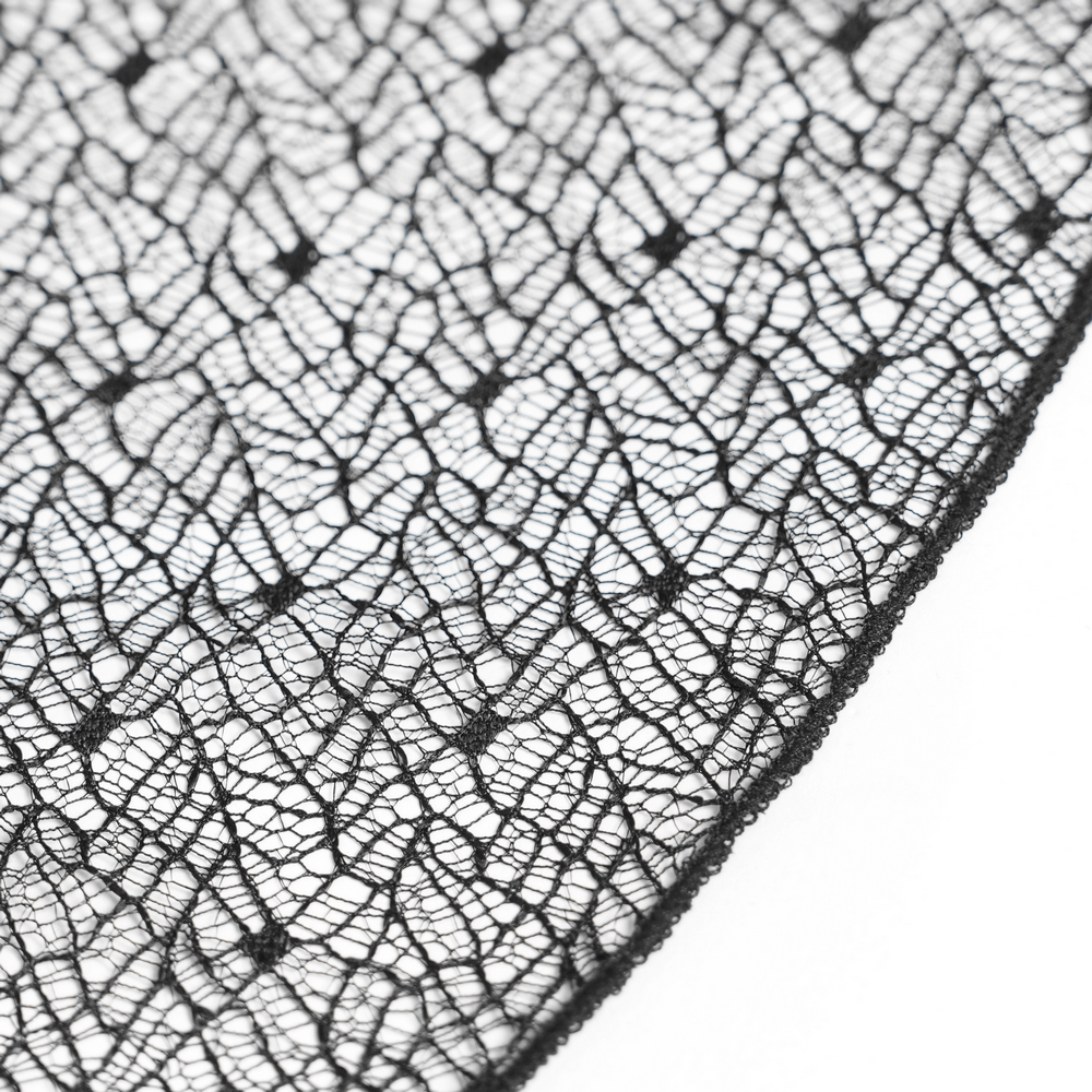 Close-up of black lace fabric, perfect for Gothic Burgundy Halter Dress with Lace Layers.