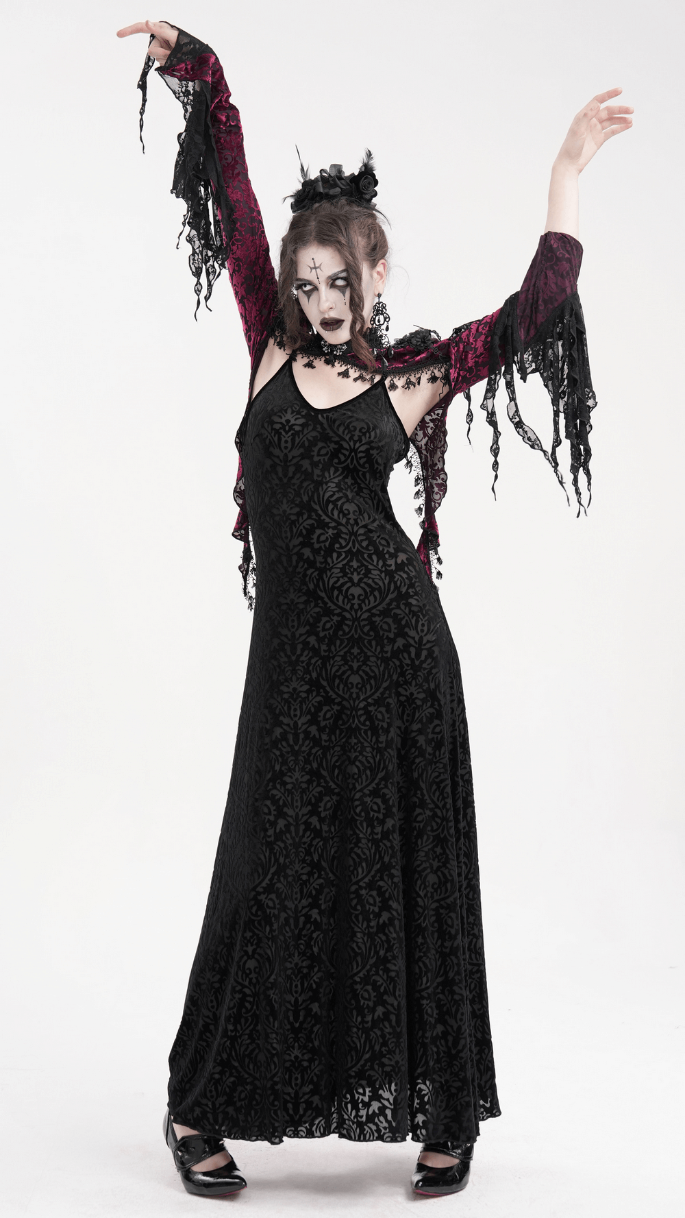 Model showcasing a Gothic burgundy lace bolero with dramatic bell sleeves, styled for a dark elegance look.