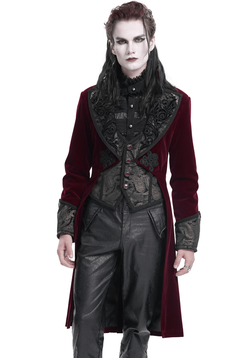 Gothic burgundy velvet tailcoat with embossed accents and gems, worn by model showcasing Victorian elegance and modern flair.