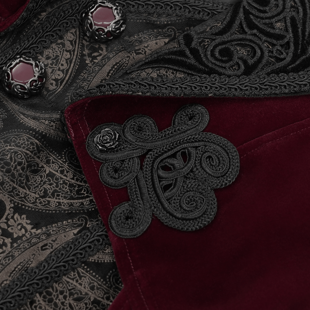 Close-up of gothic burgundy tailcoat with embossed black brocade, gem-encrusted buttons, and intricate cuff detail.