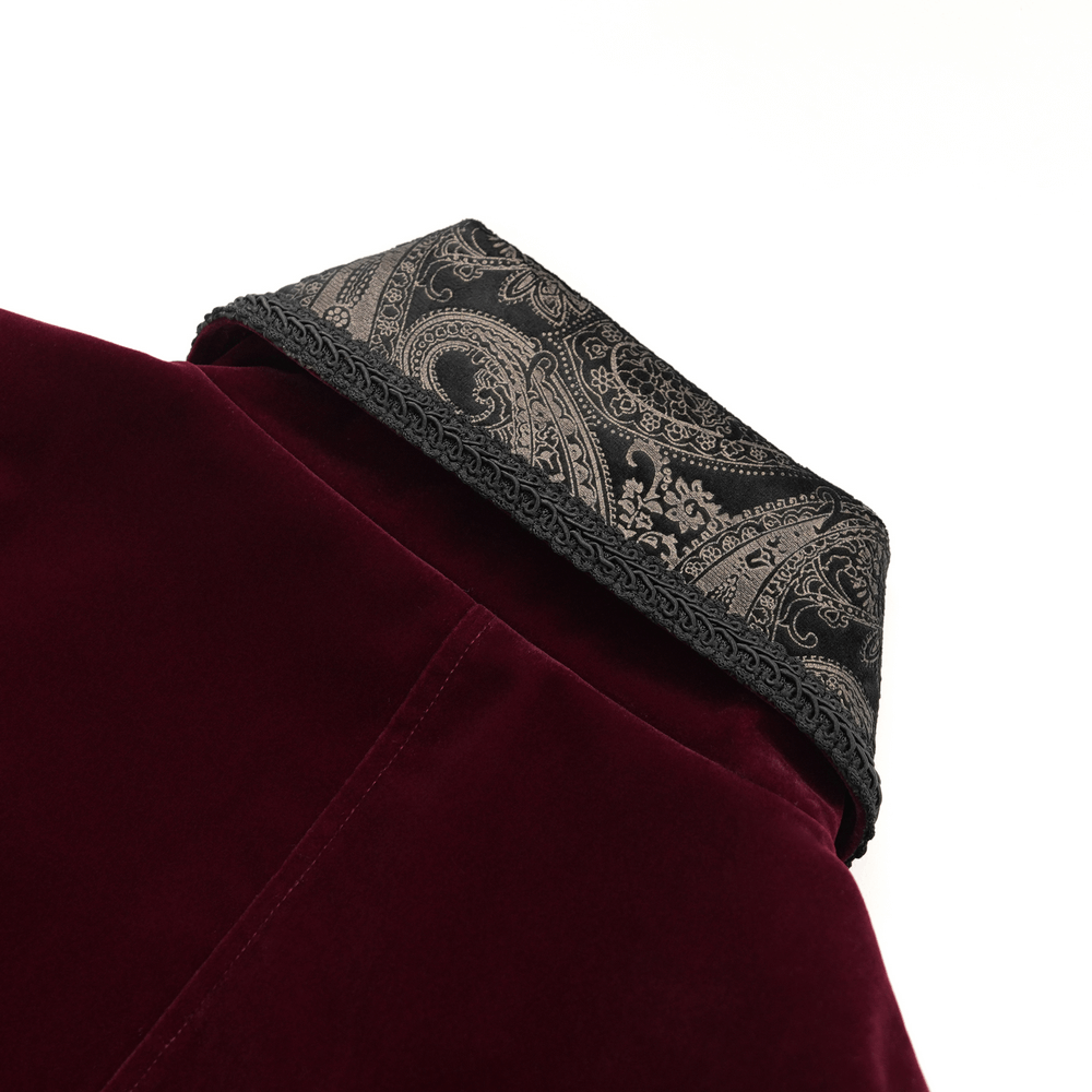 Close-up of the gothic burgundy velvet tailcoat collar showcasing embossed black brocade detailing.