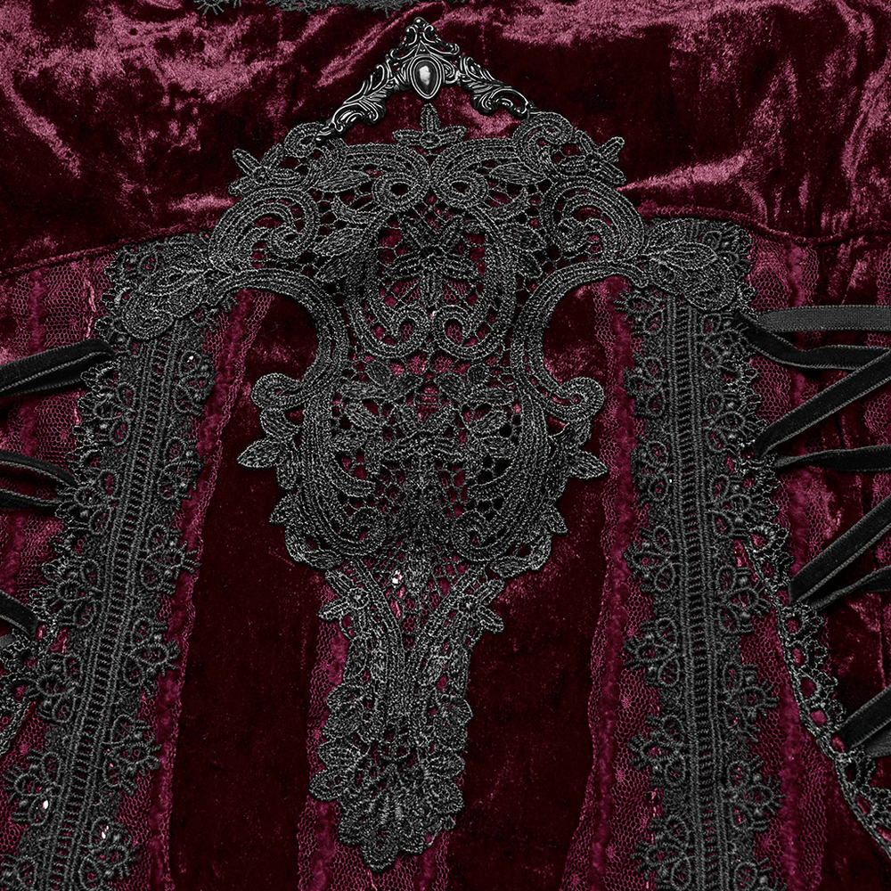 Close-up of Gothic burgundy velvet dress showcasing intricate black lace and metal details for a luxurious look.