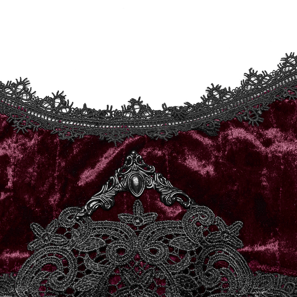 Gothic burgundy velvet dress detail featuring intricate black lace trim and elegant metal embellishments.