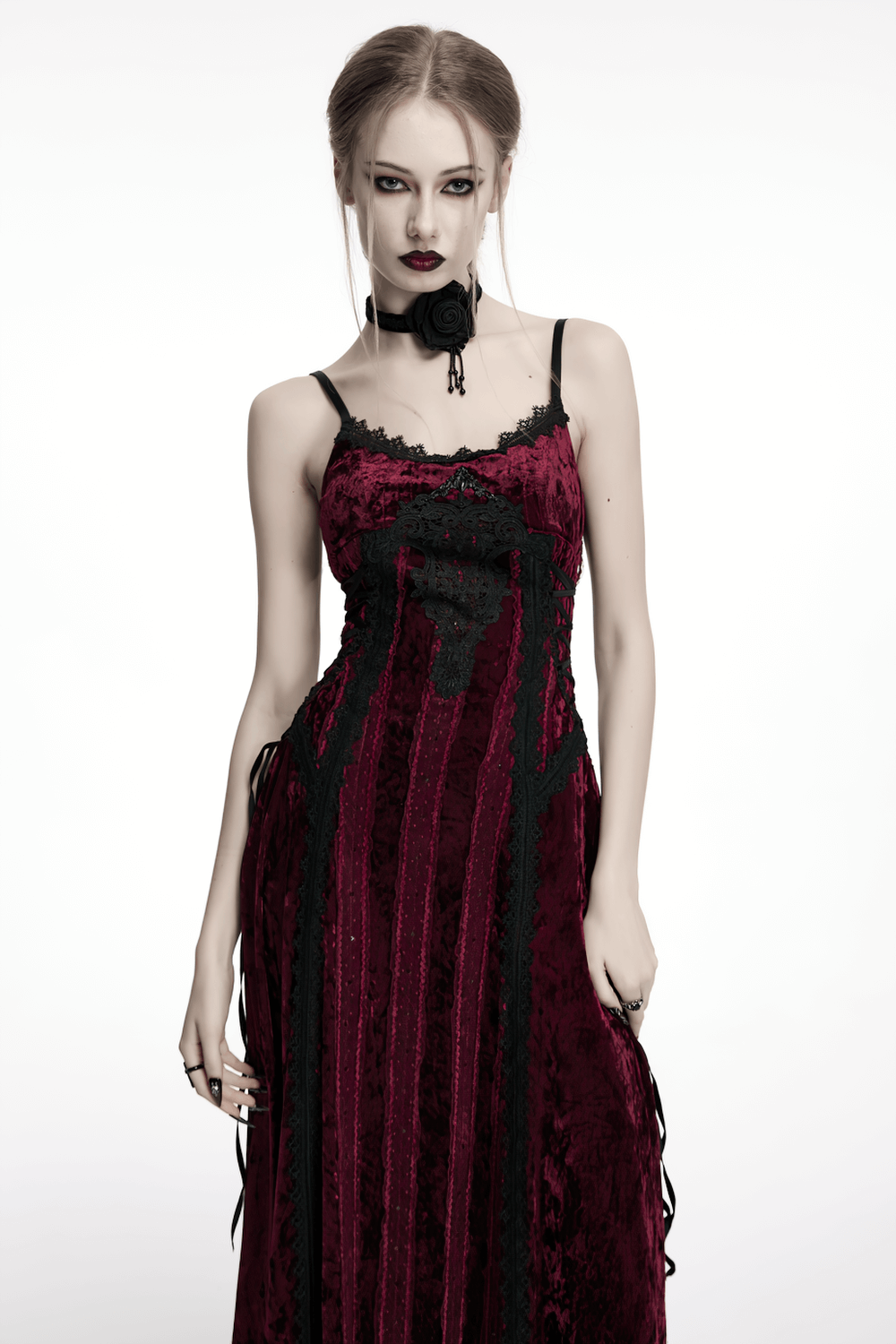 Gothic burgundy velvet dress with lace and metal details, featuring adjustable straps and a vintage-inspired design.