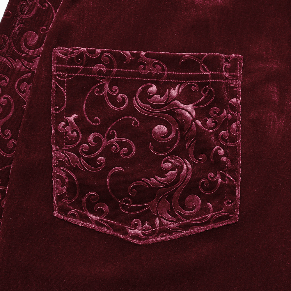 Close-up of embossed burgundy velvet pocket detailing on Gothic flared pants, showcasing elegant patterns.