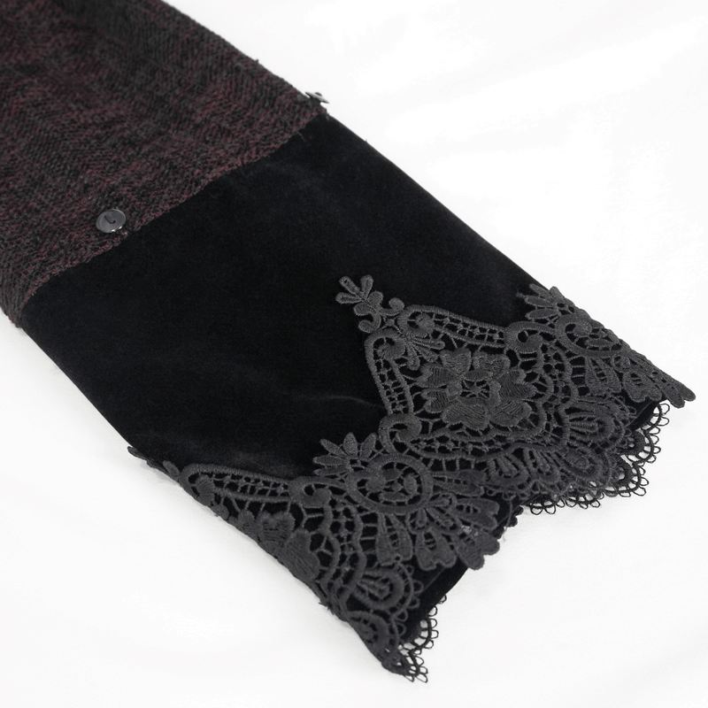 Close-up of a Gothic burgundy coat sleeve featuring black lace detailing and a button.